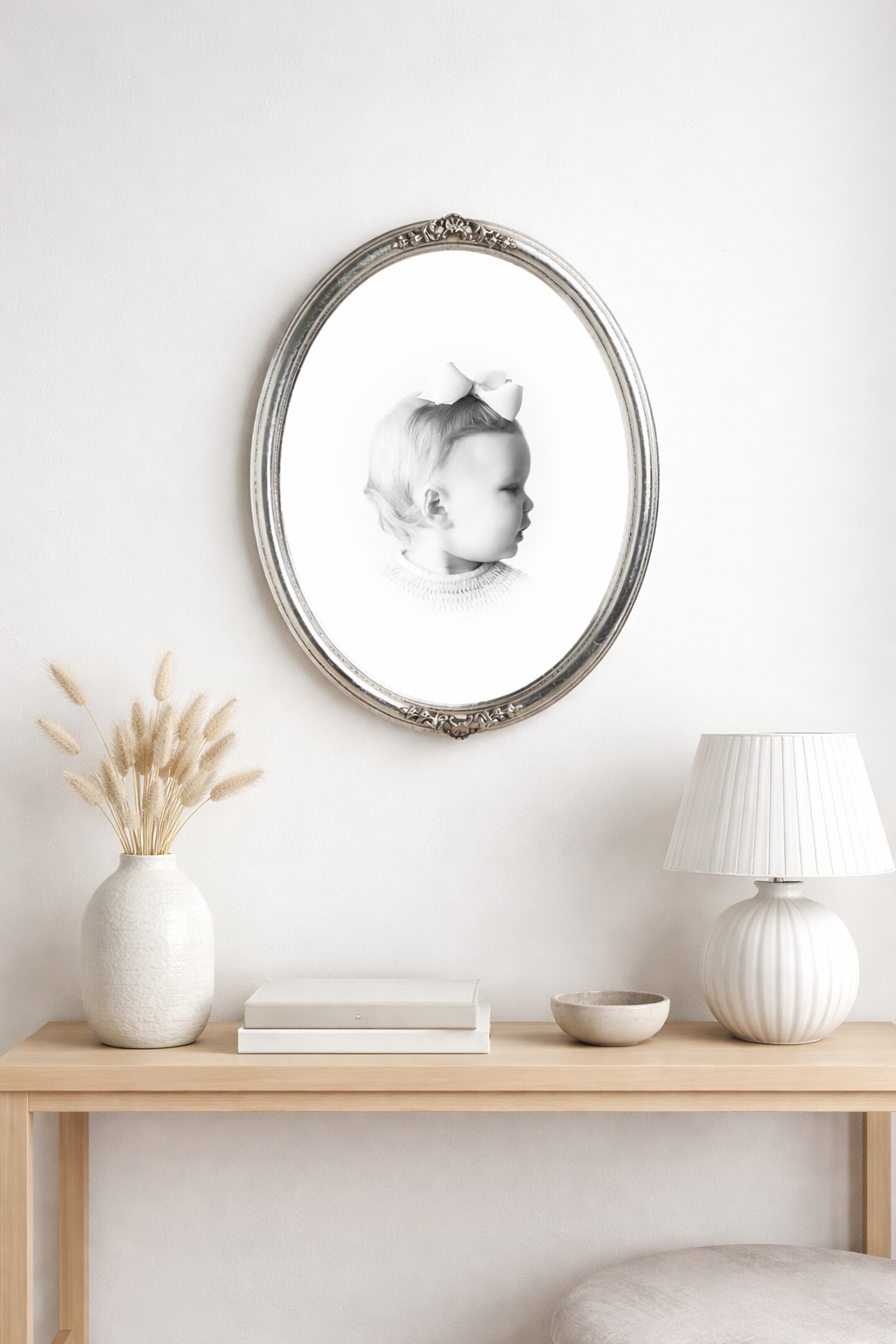 a childhood portrait in black and white framed in silver